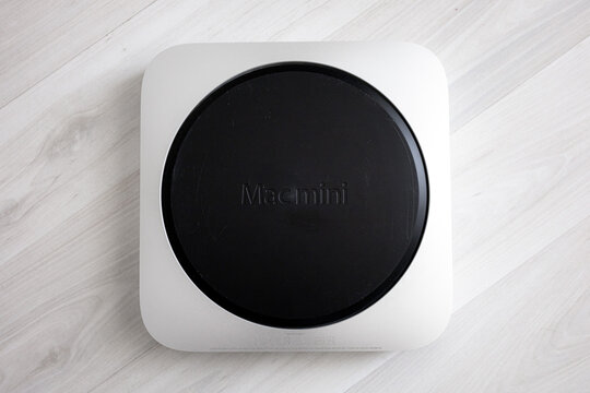 Silver Apple Mac mini Late 2014 on a white background. Compact desktop computer with minimalist aluminum design, isolated studio product photography for technology and workspace concepts.