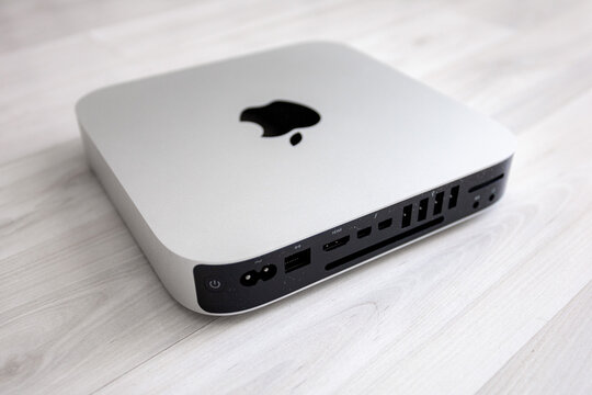 Silver Apple Mac mini Late 2014 on a white background. Compact desktop computer with minimalist aluminum design, isolated studio product photography for technology and workspace concepts.