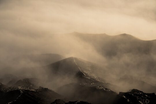 Foggy mystical sunrise landscape in Java Indonesia mountains