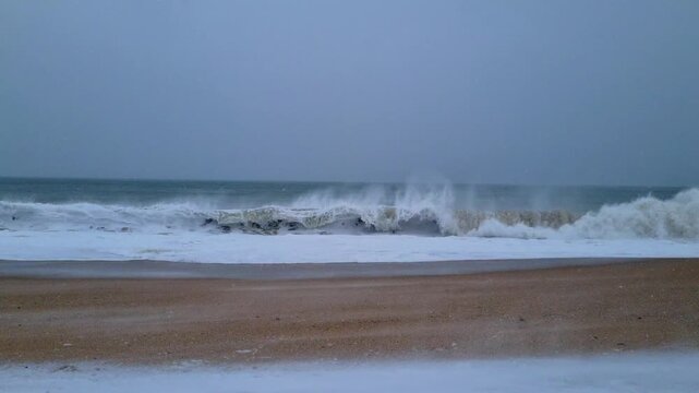 Soft rolling waves under blue horizon creating peaceful minimalist seascape composition.