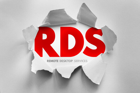 RDS text with remote desktop services theme revealed by torn paper, representing virtual workspaces, remote computing, server sessions, digital workplaces and enterprise access solutions