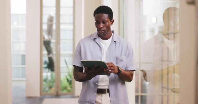 Serious, employee and man with tablet, office and review design project on web, scroll and creative. Browsing, online and black person with tech for typography, font designer and editing digital art