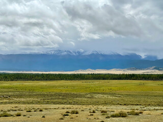 Clouds lying on the tops of the Altai mountains