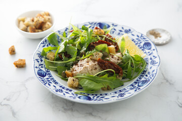 Green salad with tomatoes and cream cheese