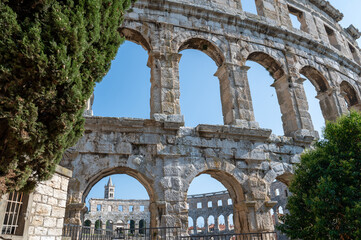 Part of the amphitheater with trees in Pula, Croatia