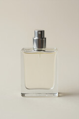 Clear Glass Perfume Bottle With Silver Spray Nozzle On Plain White Background, Minimalist Product Shot