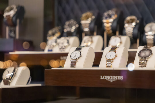 Poznan, Poland - December 13, 2025: Longines luxury watches elegantly presented on white stands within a high-end retail display, symbolizing opulence and fashion