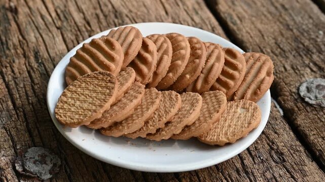 Biscuits and fresh milk on wooden background. a cup of milk and biscuits on a wooden table for a light breakfast.