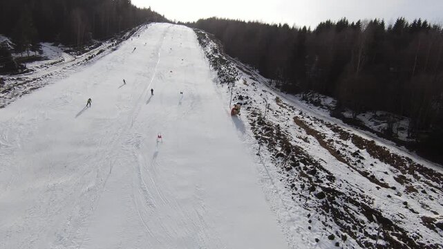 FPV Drone Footage of an Alpine Ski & Snowboard Race with High-Speed Downhill Action on Snowy Mountain Slopes