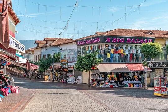 Retail shops and textile stores at the Big Bazaar on Hukumet Caddesi street in Alanya. Popular pedestrian shopping district for tourists. Alanya, Turkey - October 25, 2020