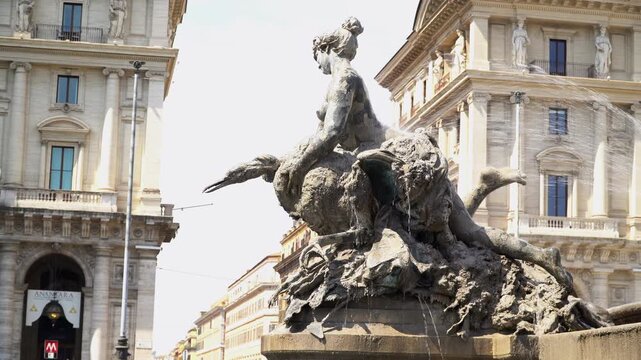 A bronze sculpture of a nymph at the fountain of the Naiads in Rome, Italy.	
