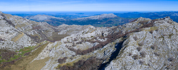 Obraz premium Aerial view from a drone in the karst massif of the Sierra de Hornijo. Collados del Asón Natural Park. Soba Valley. Pasiegos Valleys. Cantabria. Spain. Europe