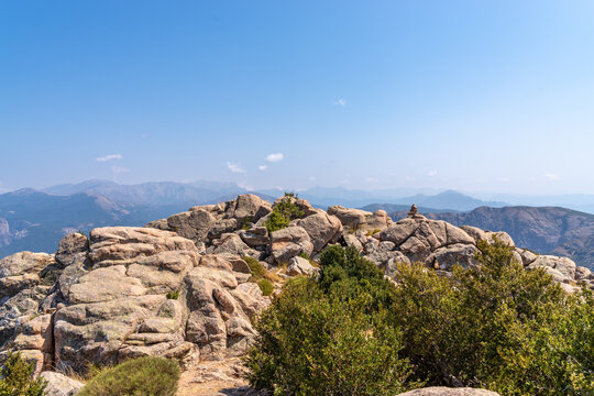 Rocky peaks and distant mountains in Ota, Corsica