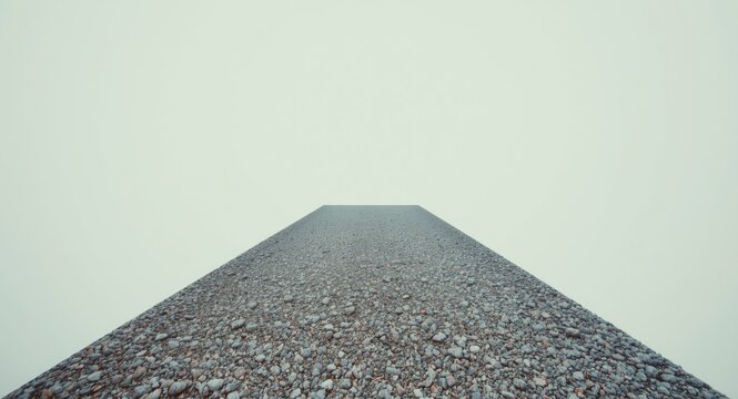 Copy space background showing a natural grey gravel pathway with uneven texture