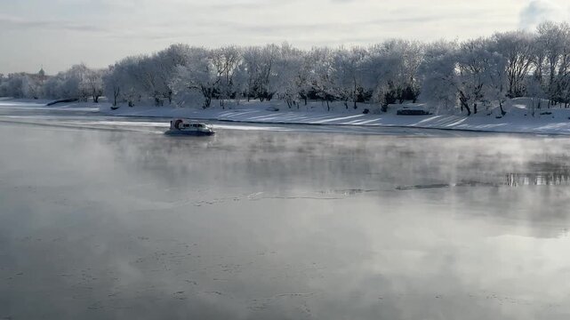 A rescue hovercraft navigates a frozen river