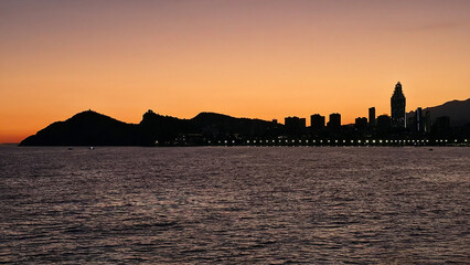 Benidorm skyline at sunset with mediterranean sea © Chebix