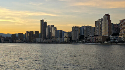 Obraz premium Benidorm skyline at sunset over mediterranean sea