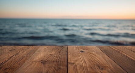 Fototapeta premium Wooden table featured in front of rich golden hour hues and serene sea background