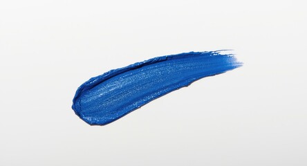 Obraz premium Makeup color palette featuring classic blue lipstick mark on bright white backdrop
