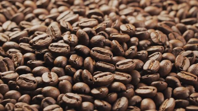 Coffee beans in close up showing texture and color in natural light for coffee lovers and roasters