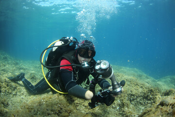 Older diver explores the underwater world while adapting to their physical challenges and enjoying marine life