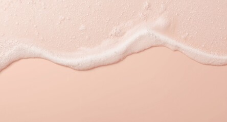 Muted blush pastel surface with white foam bubbles for laundry advertising