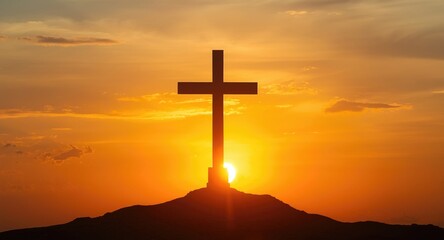 Christian cross rising before a glowing sunset creating a powerful image with copy space for religious inspiration
