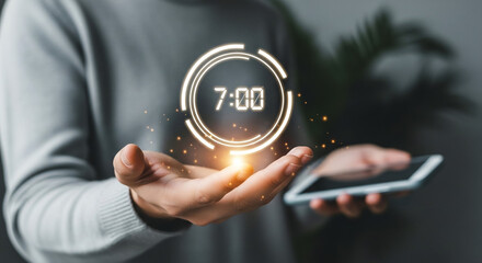 Person holding digital clock and smartphone with glowing neon time display
