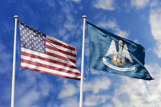 United States and Louisiana State Flags Waving in Unison Against a Blue Sky Representing Federal Unity Pelican Heritage Maternal Sacrifice and the Historic Spirit of the Bayou State