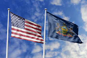 United States and Pennsylvania State Flags Waving in Unison Against a Blue Sky Representing Federal...