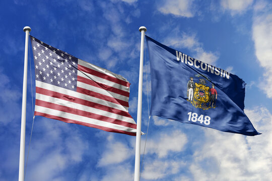 The American flag and the Wisconsin state flag fly together under a bright sky, symbolizing industrious progress, Midwest strength, national unity, and the enduring legacy of the Badger State.