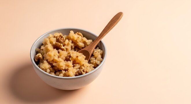 Small bowl of charoset mixture with wooden spoon