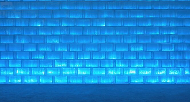 Structured white brick wall made from vibrant blue glowing ice blocks