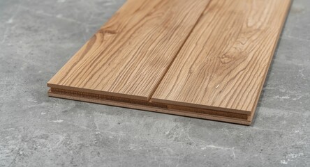 Fototapeta premium Laminated timber floor boards fixed on concrete surface showcasing effective adhesive for long lasting floors