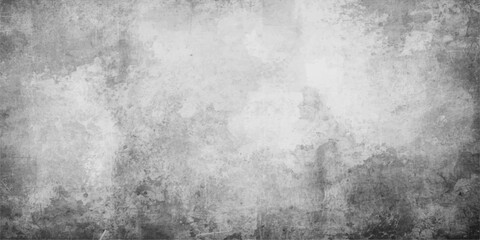 Fototapeta premium A dark vintage grunge wall background features a rough grey concrete texture and dirty stone surface with an old weathered paint pattern on a black cement canvas material