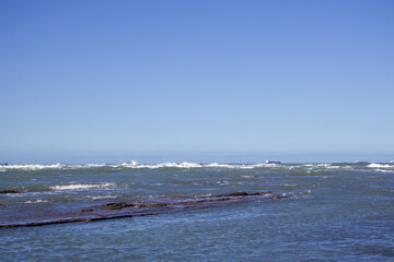 Rocky shoreline with gentle ocean waves