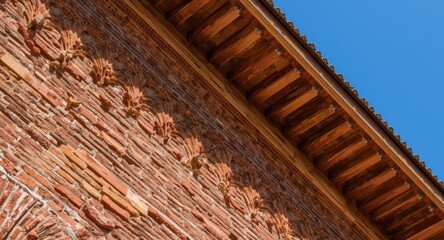Ornate brick wall design paired with wooden roof viewed from close range