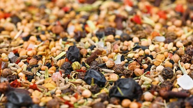 capturing a diverse collection of aromatic dried spices, including pungent chili flakes