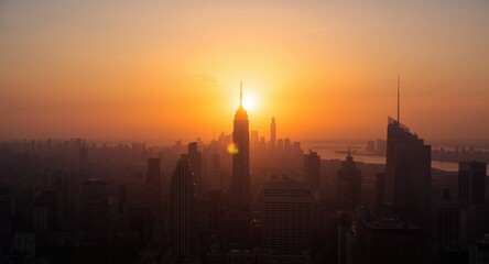 Fototapeta premium The glowing morning sun paints the city skyline in warm hues