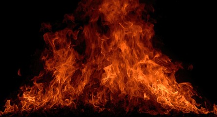 Lively fire sparks and swirling flames in bright colors on stark black canvas