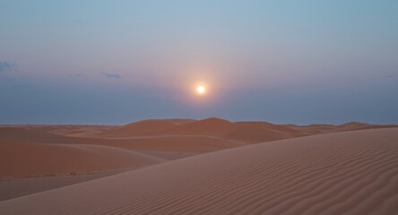 Still desert terrain at moonrise with subtle tones and blank writing area