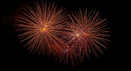 Fototapeta premium Energetic New Year fireworks illuminating black background with vibrant bursts
