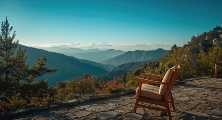 Fototapeta premium Charming mountain terrace including comfortable armchair and wide view