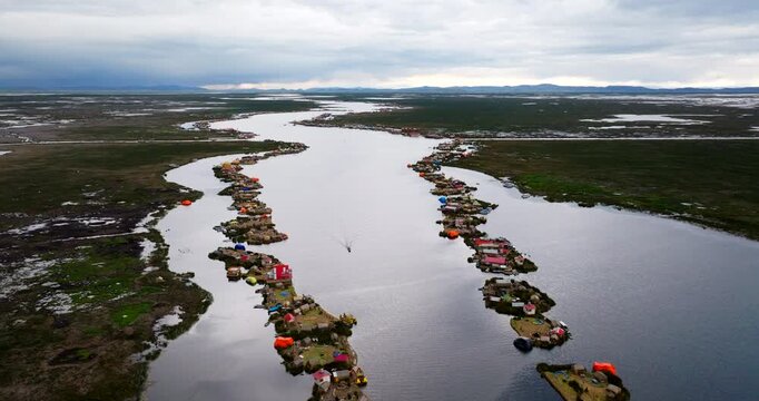 Bird's-eye drone view over Uros floating islands on Lake Titicaca in Peru