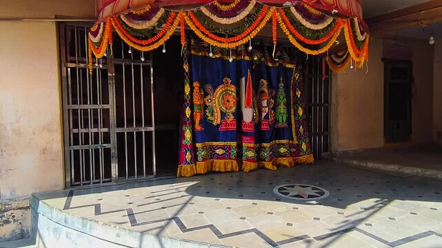 shanku chakra namam design on cloth it's using in hindu temples at kodangal. day time, stable shot, 4k.