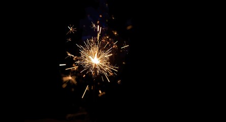Obraz premium Overlay of hand held sparkler firework isolated image