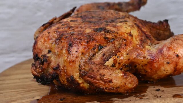 A video of a baked chicken spinning