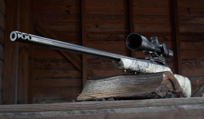 Bolt action rifle in a wood structure seen from below