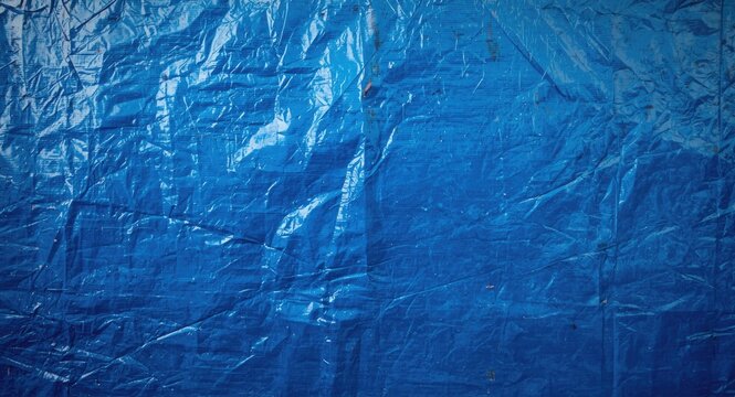Blue polyethylene tarp with rugged texture and durable surface