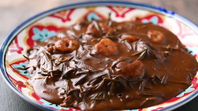Mexican romeritos with mole sauce and shrimp